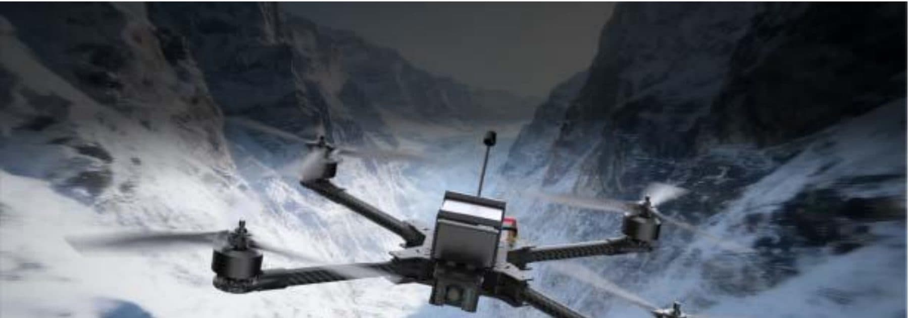 FPV drone in flight over rugged snow-mountain terrain — long-range aerial overwatch.