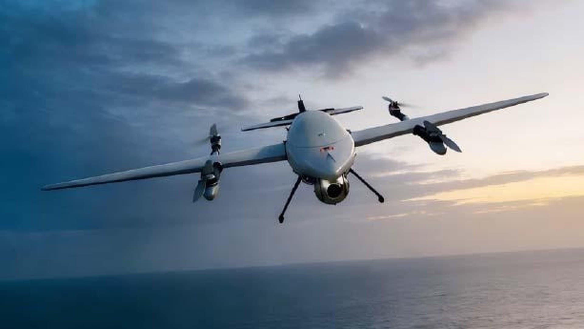 Cyron H-series VTOL hybrid drone in long-endurance cruise over coastal terrain.